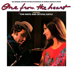 Opening Montage: Tom’s Piano Intro/Once Upon a Town/The Wages of Love - Tom Waits (Ft. Crystal Gayle)